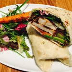 a vegan wrap and salad on a white plate for Vegan Diet Plan.