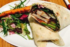 a vegan wrap and salad on a white plate for Vegan Diet Plan.