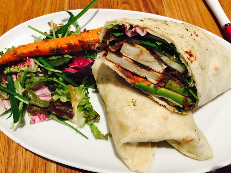 a vegan wrap and salad on a white plate for Vegan Diet Plan.
